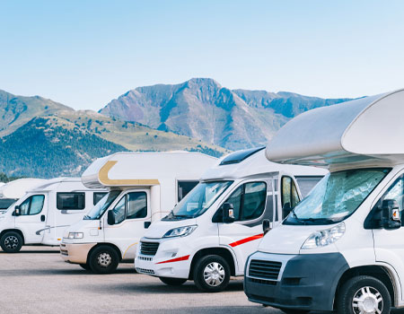 RV parked in a designated camper parking area during an event
