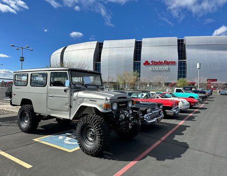 Restored classic cars parked in a lot, prepared for safe and reliable classic car transport services across the U.S.